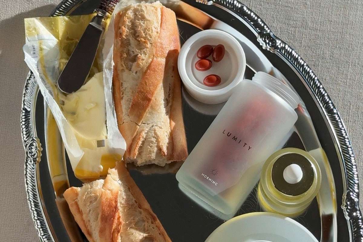 Morning supplement bottle on a tray with baguette and butter