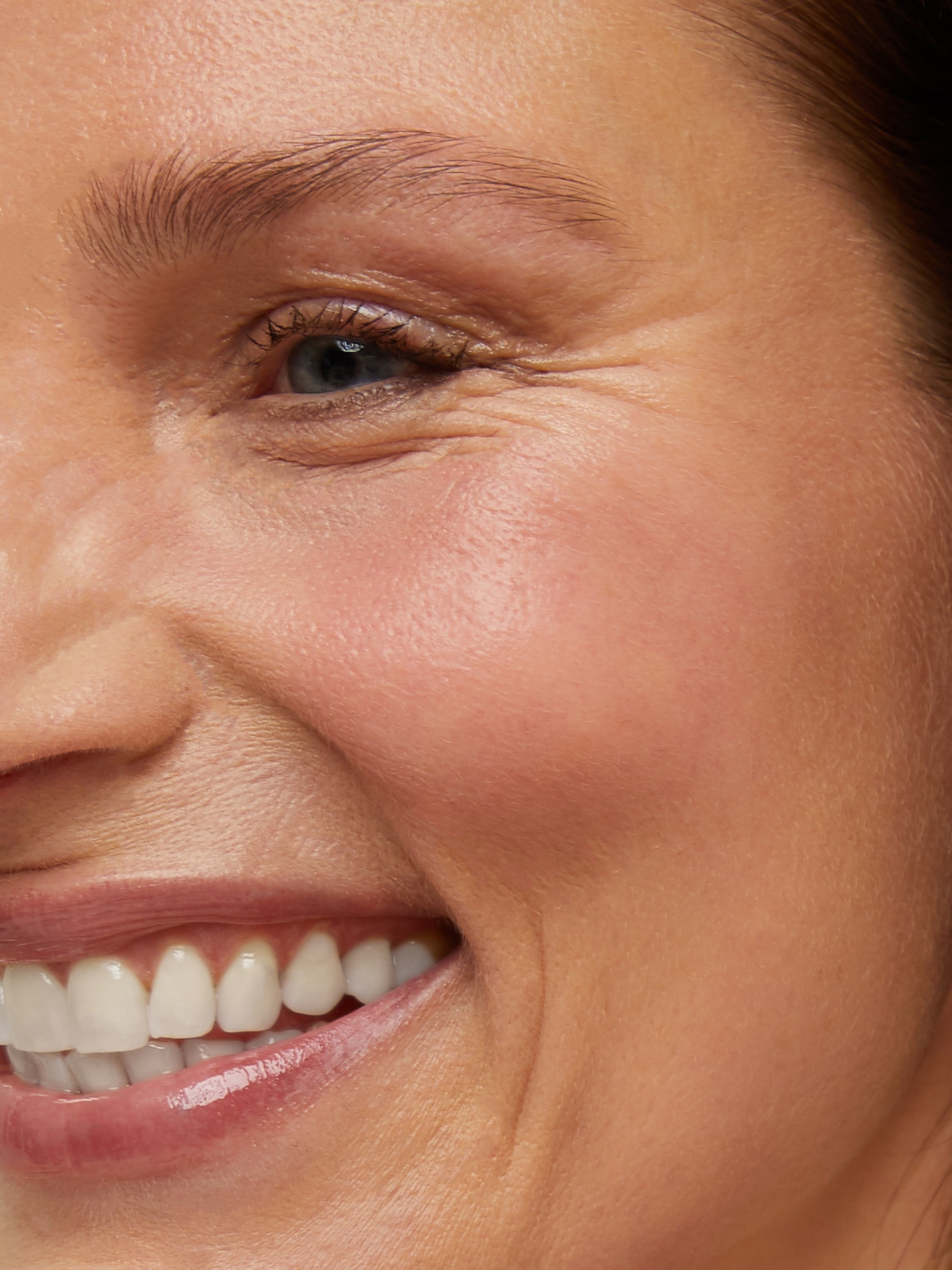 Woman smiling looking away from the camera