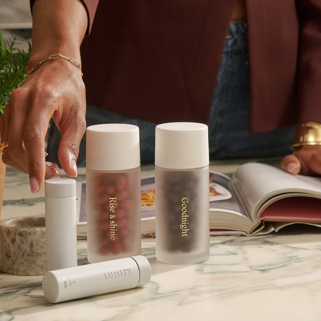 Lumity Morning & Night Supplement and Travel Cases on kitchen counter