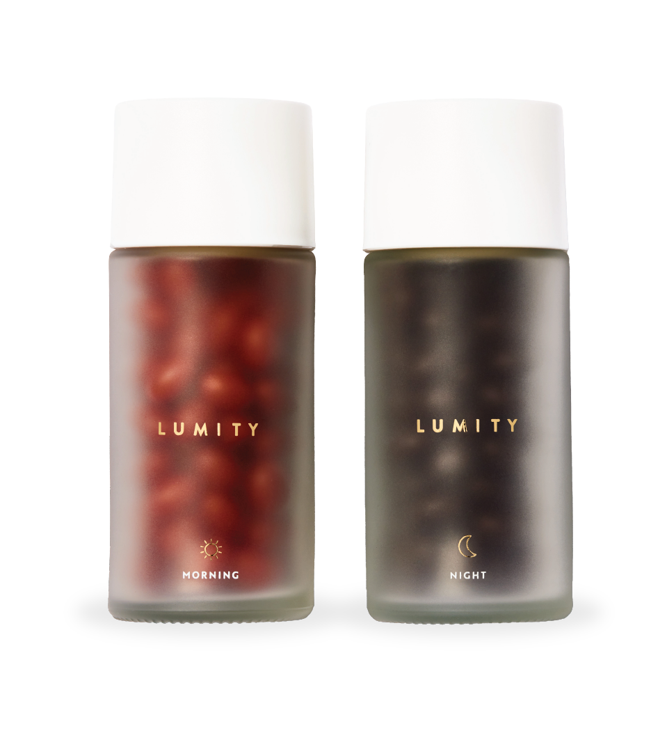 Two frosted Lumity Life bottles labeled Morning and Night filled with small brown and black beads on white background