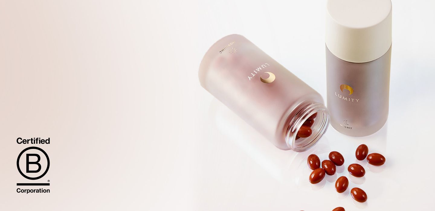 Lumity Morning & Night bottles and morning softgels spilled out on counter. Certified B Corporation logo.