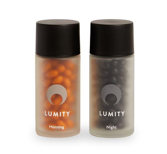 Two frosted containers with black lids holding orange and dark softgels labeled Lumity Morning and Night for daily wellness routine