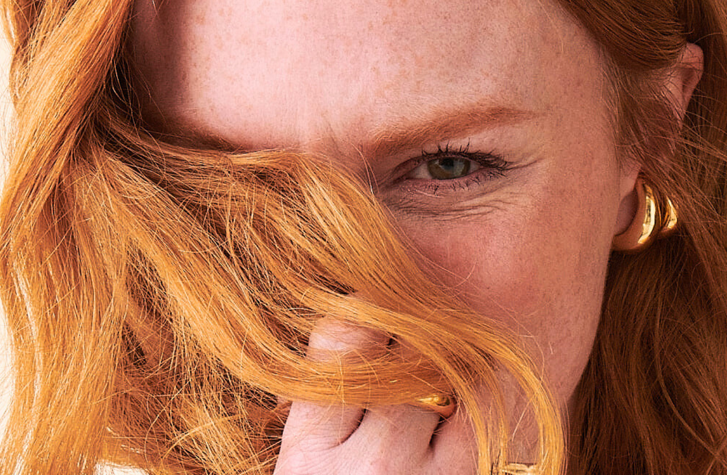 Image of woman covering face with hair