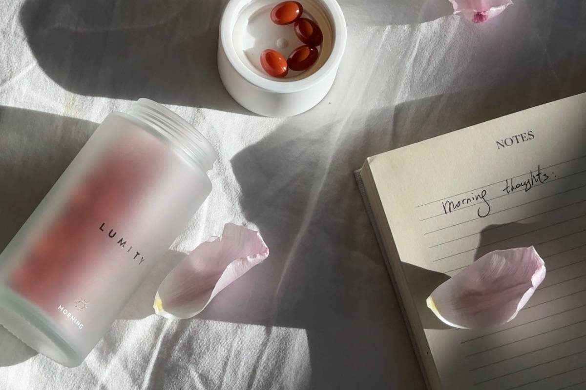 Morning supplement with journal and rose petals