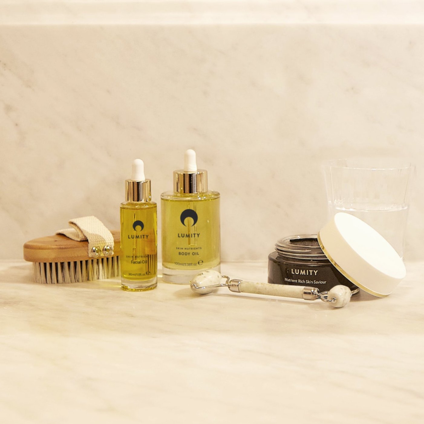 Lumity skin products and tools on bathroom counter