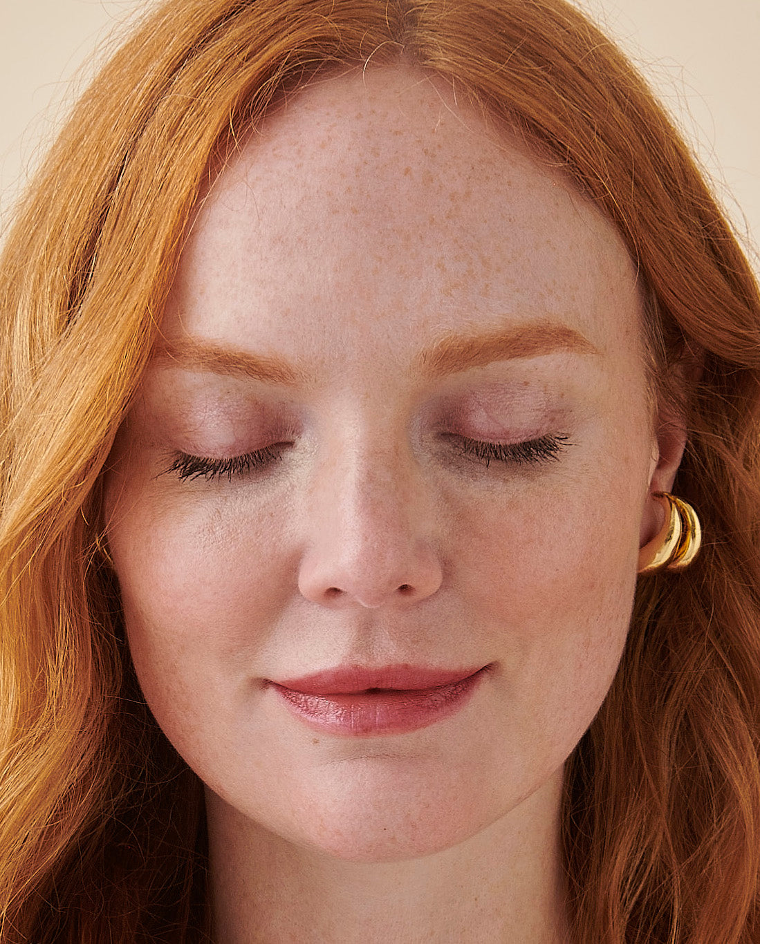 Photo of middle-aged woman closing eyes and resting.