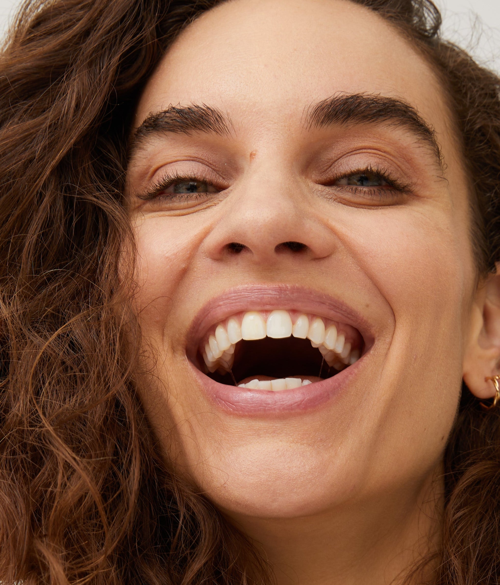 Closeup photo of woman laughing