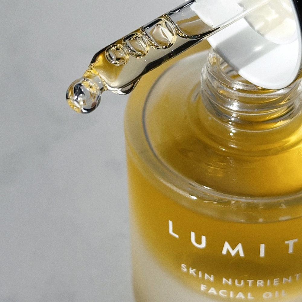close up of Lumity Facial Oi with pipette resting on top 