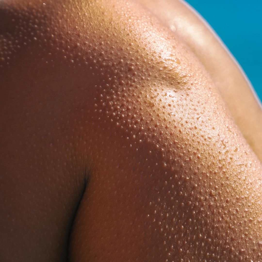 Close-up of a person's knees on a blue background