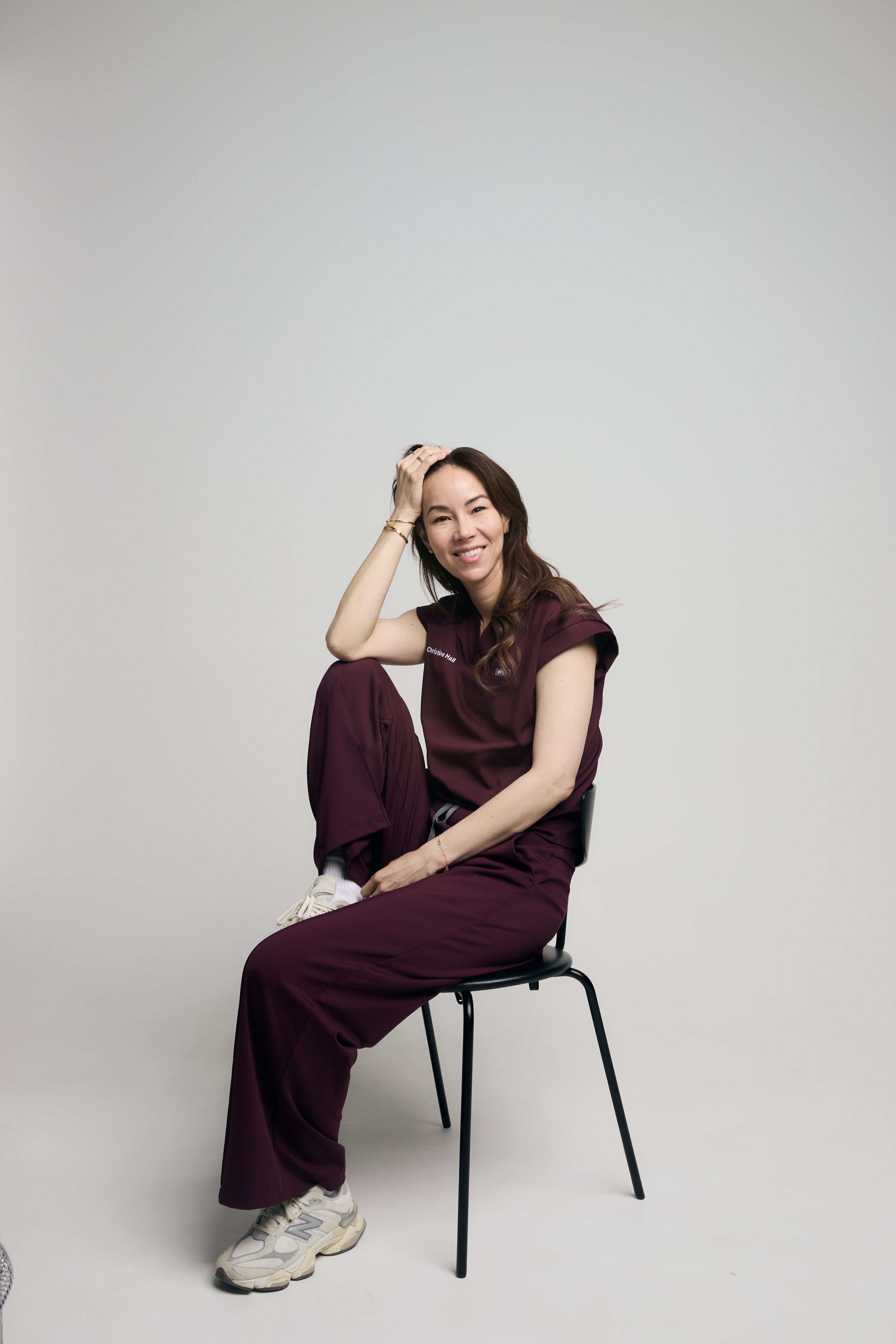 Dr Christine Hall sitting in a chair