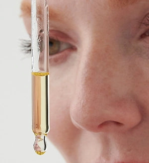 Close Up of womans face with facial oi