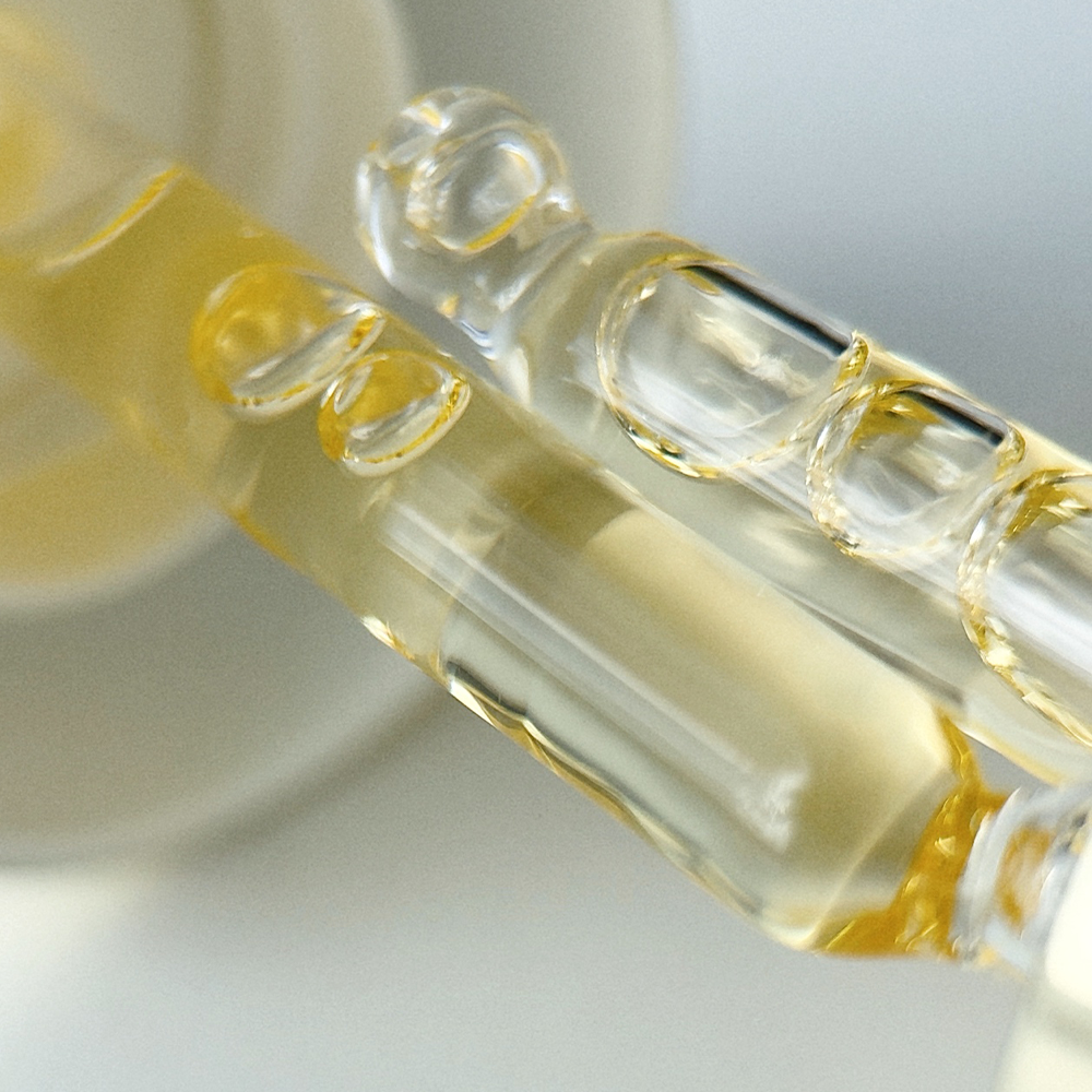 Close up of two Lumity Skin Nutrients Facial Of Pipettes 