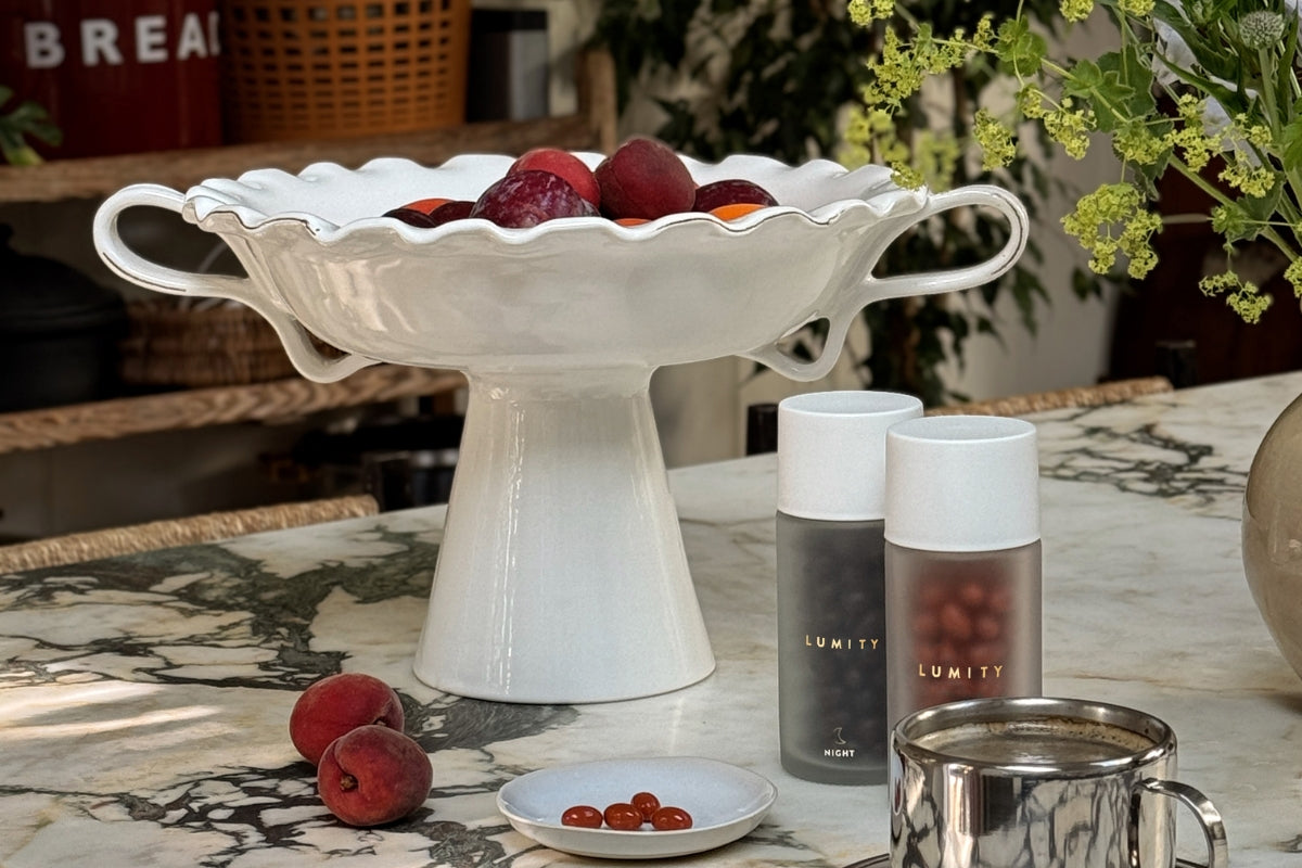 Image showing Lumity Morning & Night bottles with fruit, coffee and flowers in kitchen