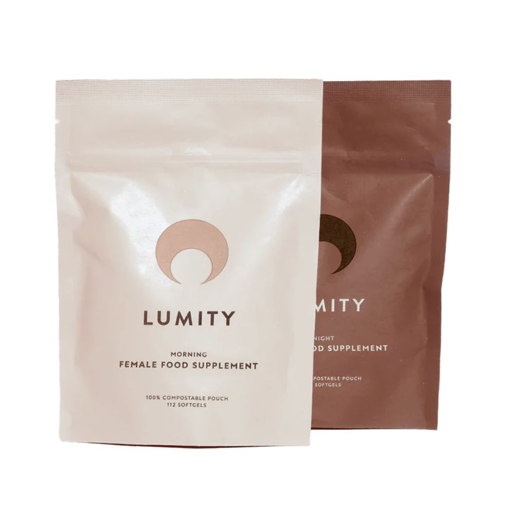 Two Lumity supplement packages, one blush and one brown, on a white background.