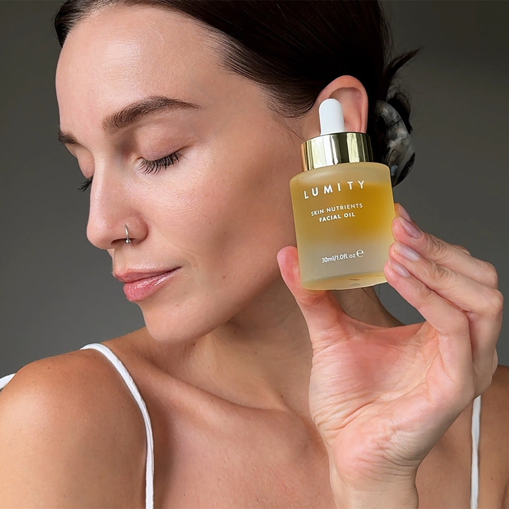 Woman Holding Lumity Skin Nutrients Facial Oil