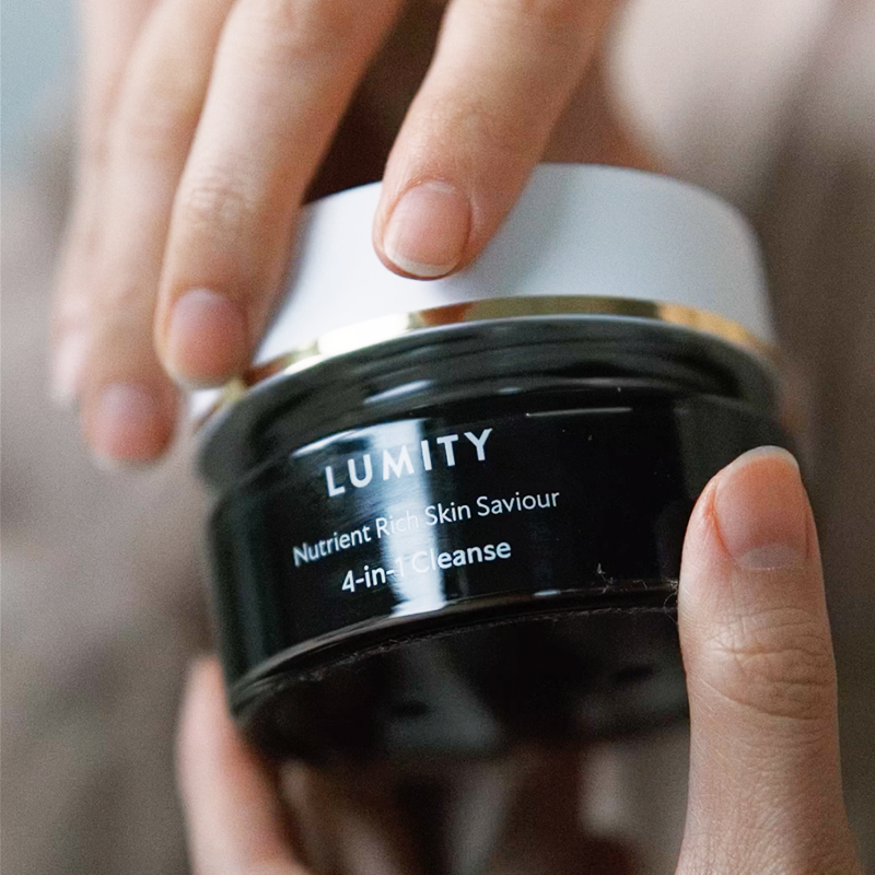A person opening Lumity Skin Nutrients 4-in-1 Cleanse