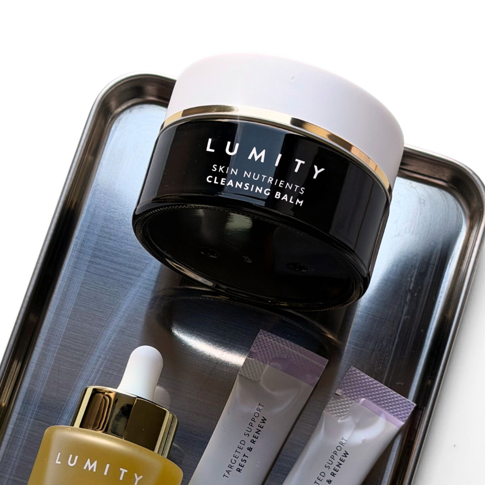 Lumity Skin Nutrients 4-in-1 Cleanse, Facial Oil and Lumity Targeted Support Rest & Renew Sachets on a tray