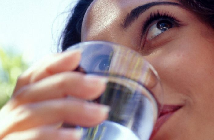 Close up of person drinking water
