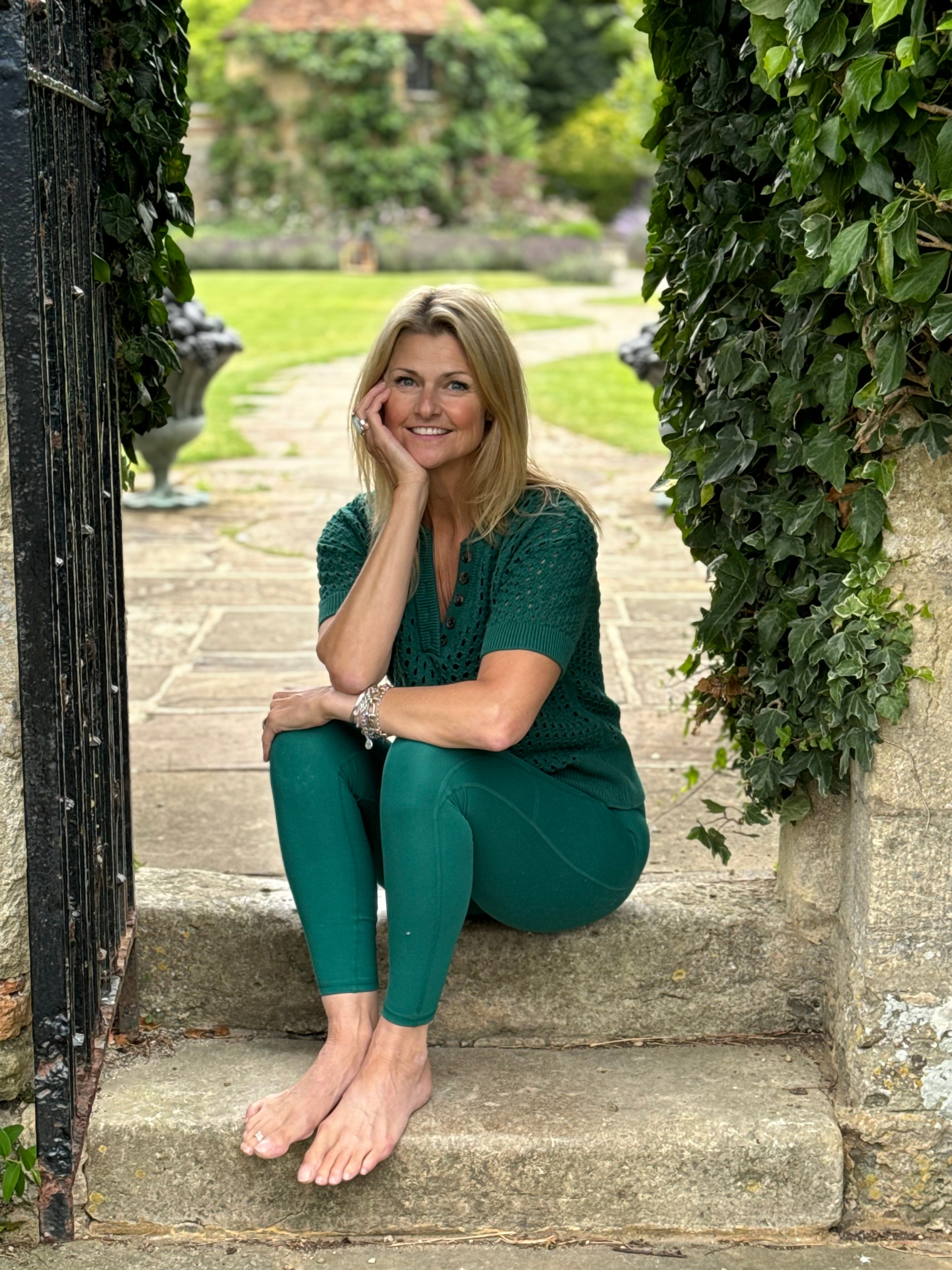 Jo Tuffrey sitting and smiling